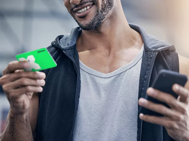 Man holding his pluxee card